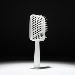 Cécred Detangling Brush shown in full to highlight its sleek design and signature wide, flexible bristles.