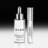 Two clear glass bottles with silver pumps and caps labeled 