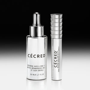 Two clear glass bottles with silver pumps and caps labeled 