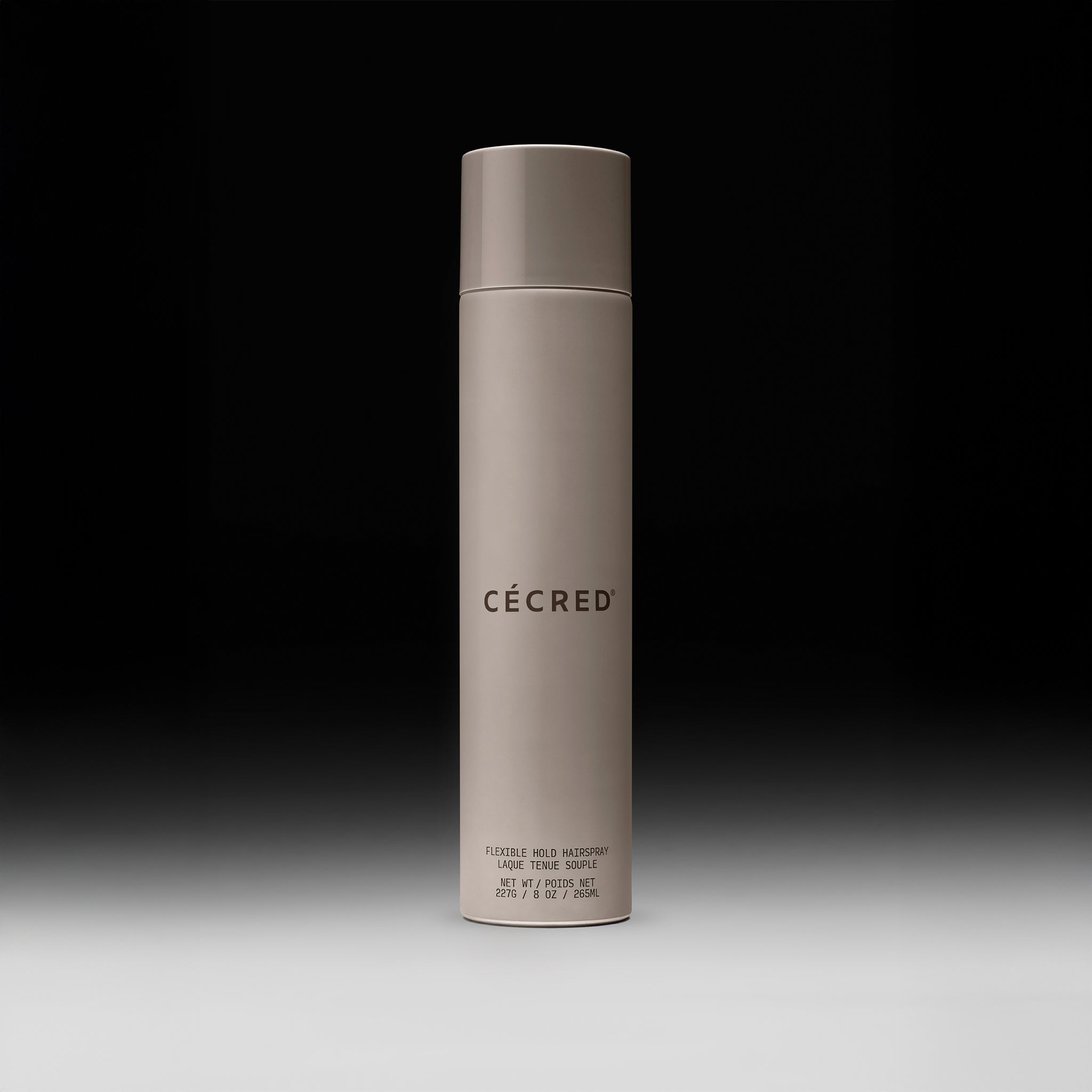 Cécred Flexible Hold Hairspray bottle displayed upright on a gradient black-to-white background.