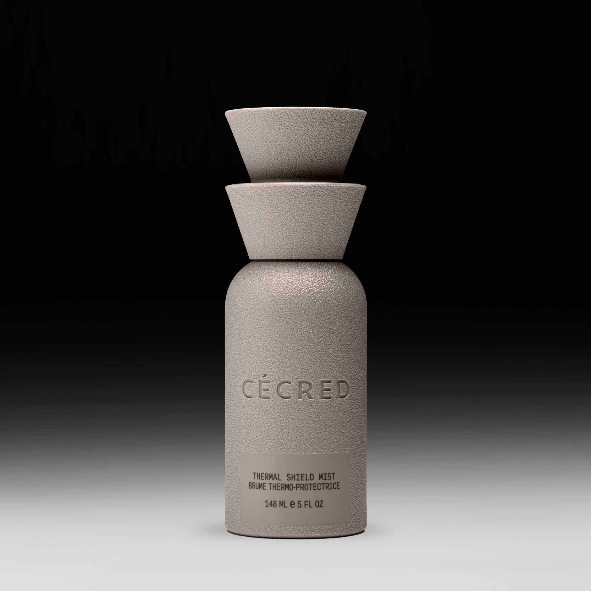 Cécred Thermal Shield Mist bottle displayed upright on a gradient black-to-white background.