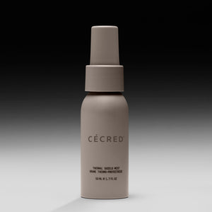 Beige spray bottle labeled 