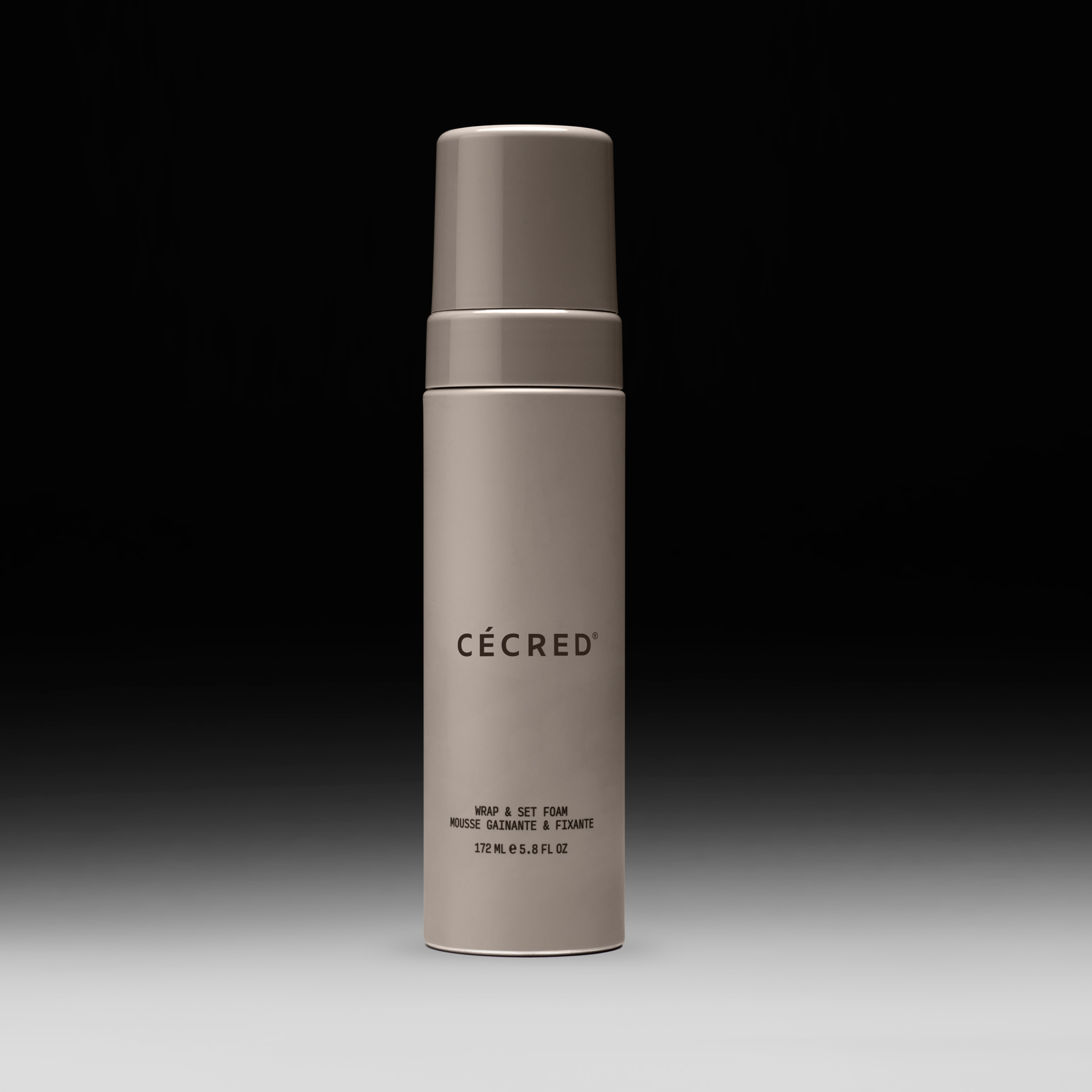 Cécred Wrap and Set Foam bottle displayed upright on a gradient black-to-white background.