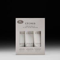 CÉCRED Hydration Hero Kit with three 74ml bottles: hydrating shampoo, hydrating conditioner, and moisture sealing lotion.