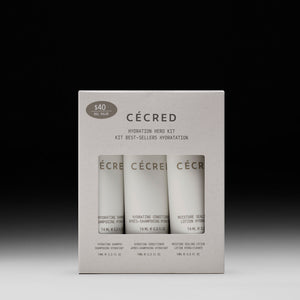 CÉCRED Hydration Hero Kit with three 74ml bottles: hydrating shampoo, hydrating conditioner, and moisture sealing lotion.