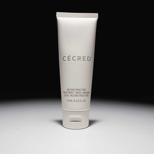 Cécred Reconstructing Treatment Mask travel size 74ml tube displayed upright against a gradient grey background